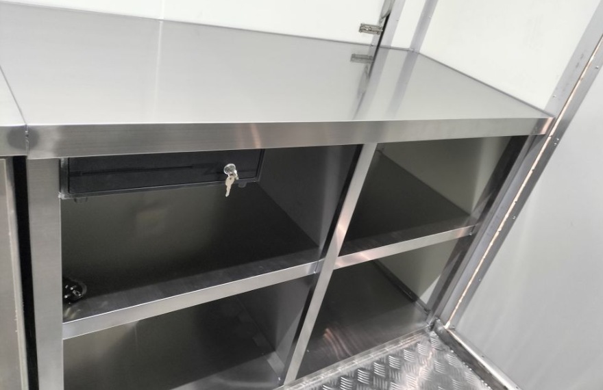 stainless steel workbench in the custom built fast food trailer